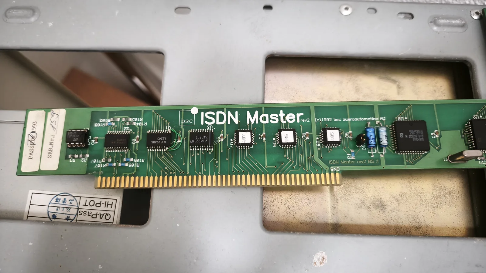 The ISDN Master rev2 expansion card by bsc büroautomation AG, removed from the machine, printed (c) 1992, with a test label along its left edge.